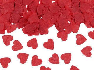 Red heart-shaped confetti in cardboard